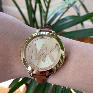 Gold with brown leather band Micheal kors Watch